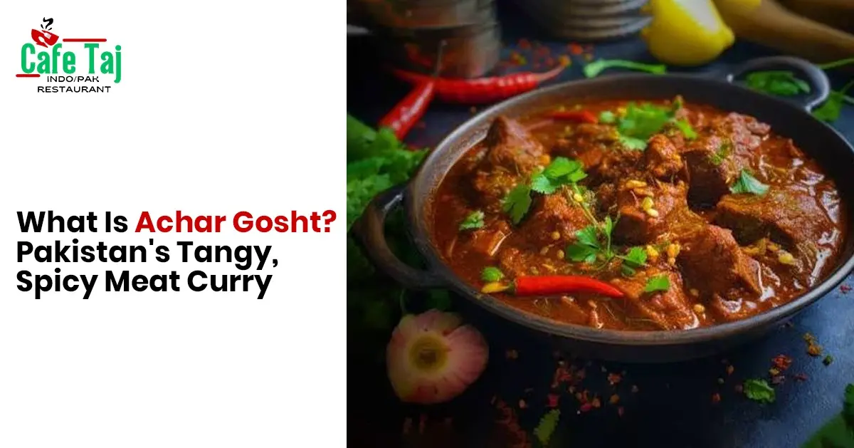 Cafe Taj image featuring Achar Gosht, a tangy and spicy Pakistani meat curry served with rich gravy, chilies, and fresh herbs