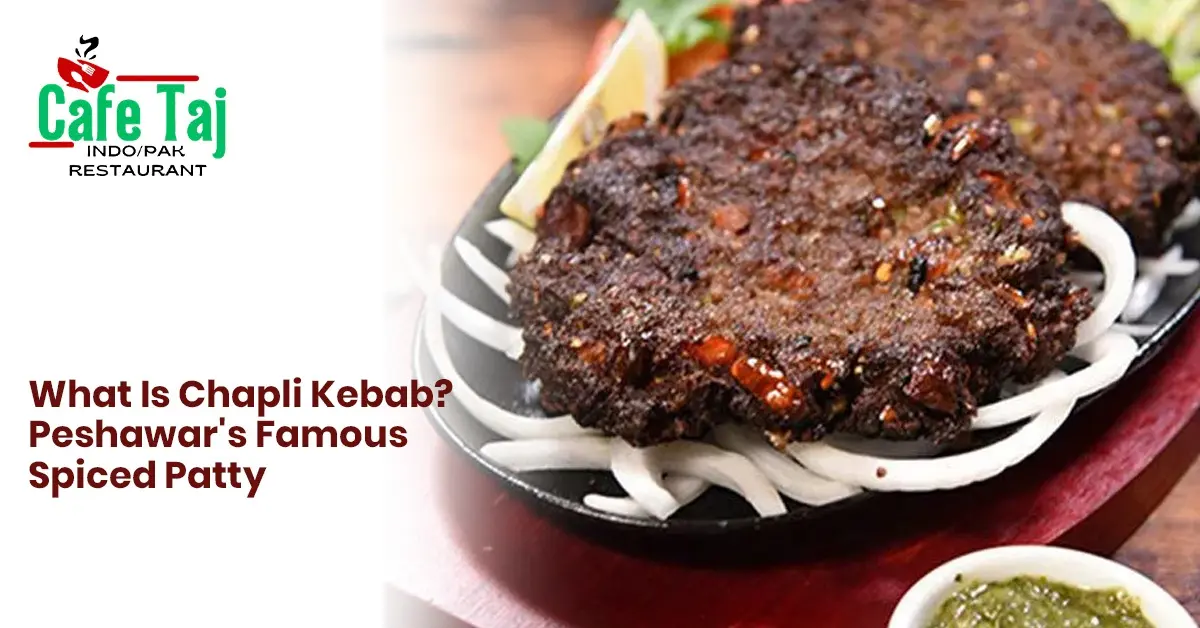 Cafe Taj Chapli Kebab featuring Peshawar-style spiced meat patties served with onions, lemon, fresh salad, and green chutney.