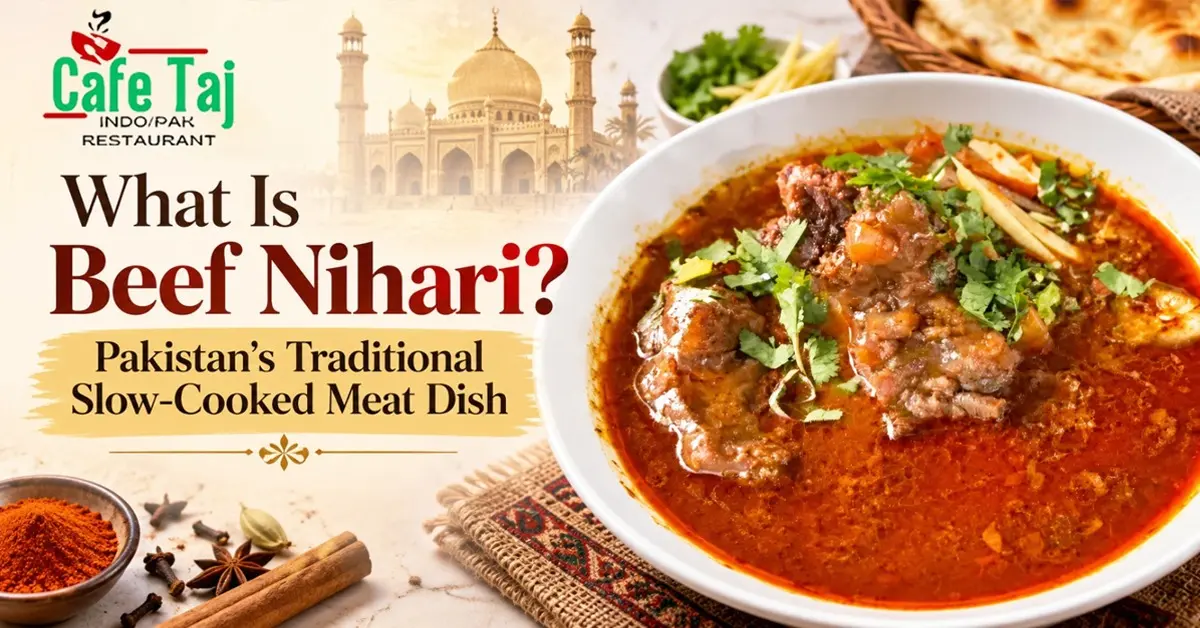 Cafe Taj Beef Nihari featuring tender slow-cooked beef in rich, spicy gravy, garnished with fresh cilantro and ginger.